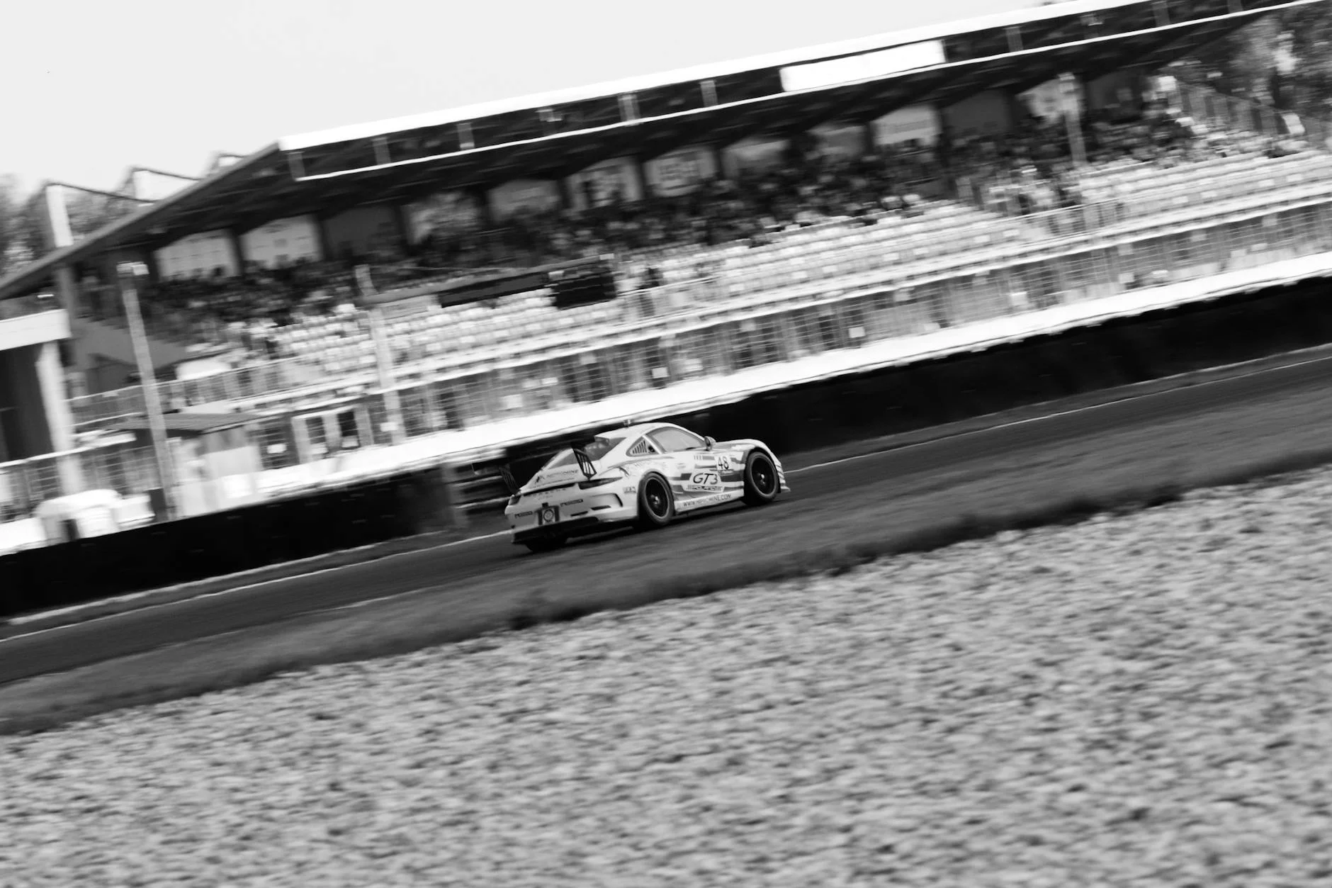 Porsche 911 sports car racing track high speed
