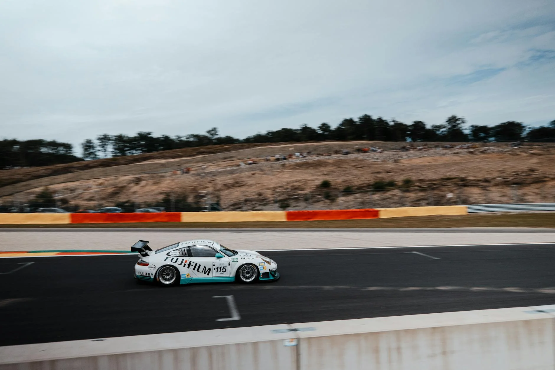 Porsche 911 GT3 race track cornering high speed