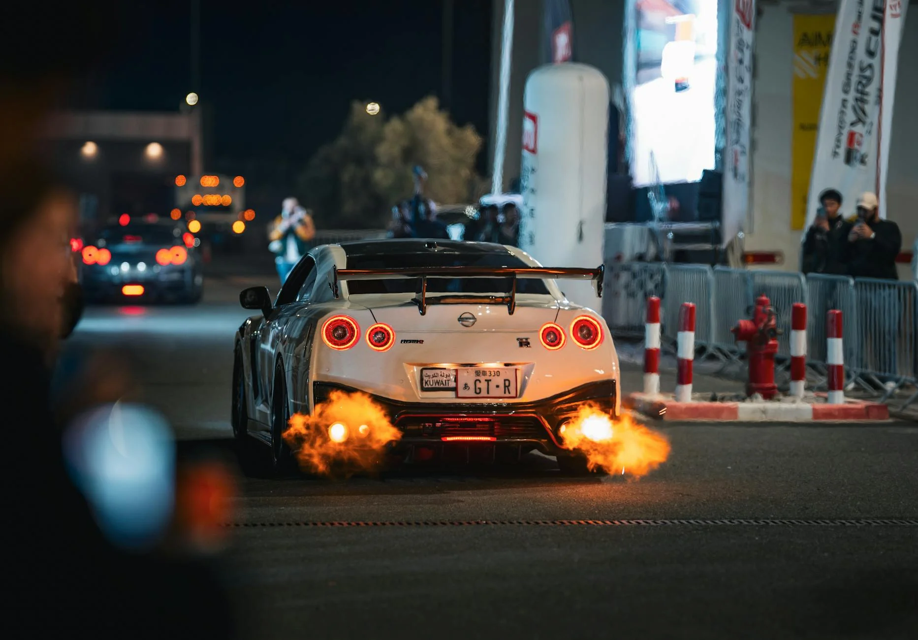 Need for Speed Unbound car exhaust flames night city street