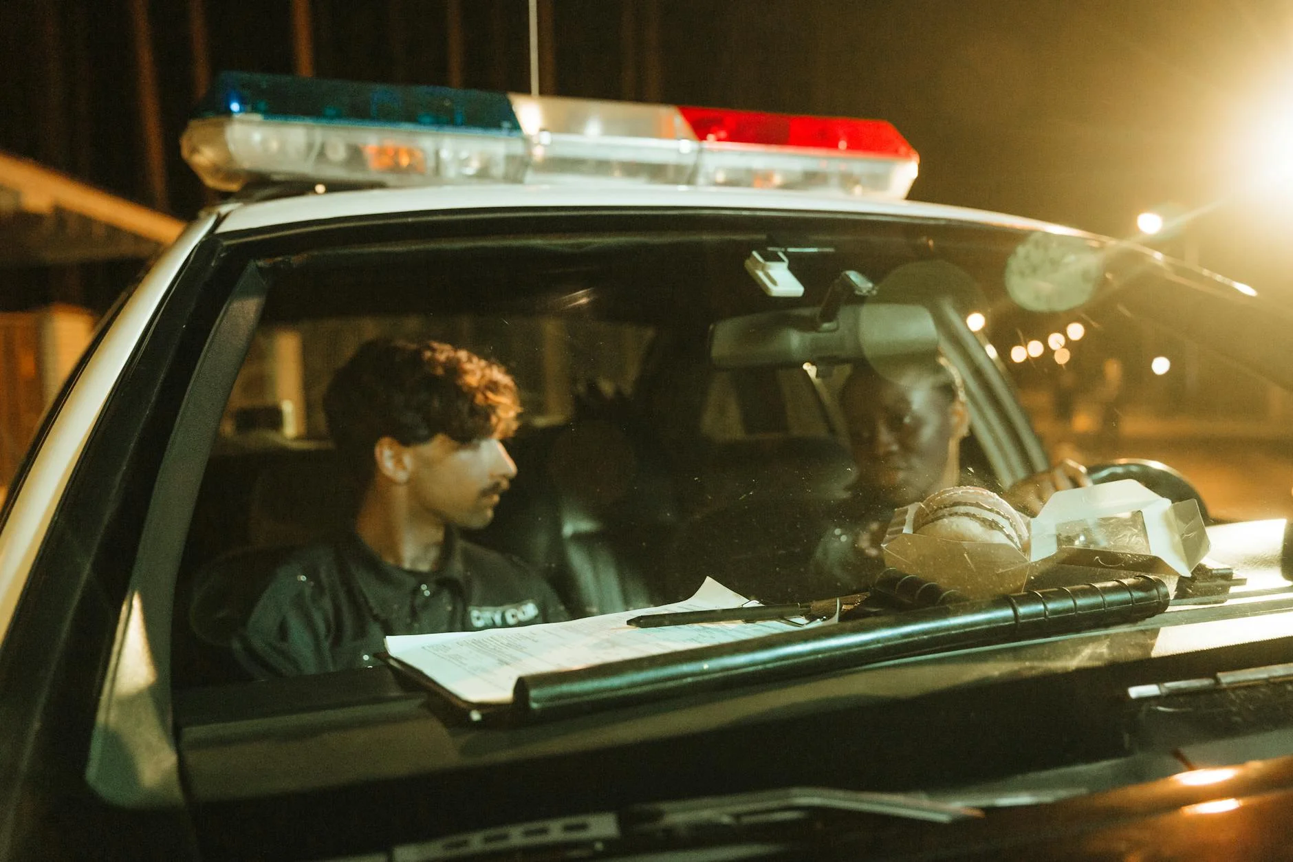 Need for Speed Heat police car chasing sports car night city streets