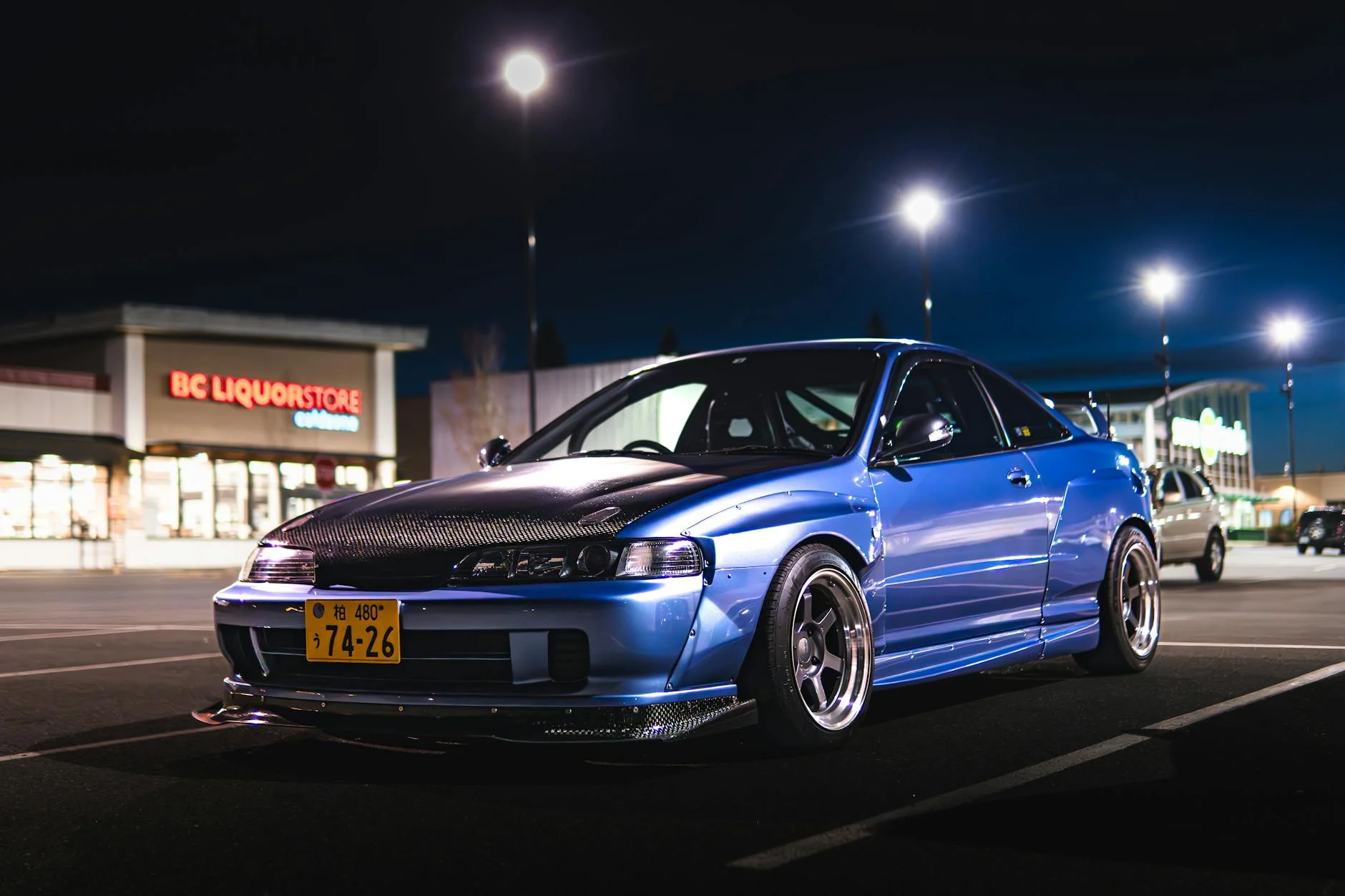 tuned car night street racing neon lights anonymous driver helmet