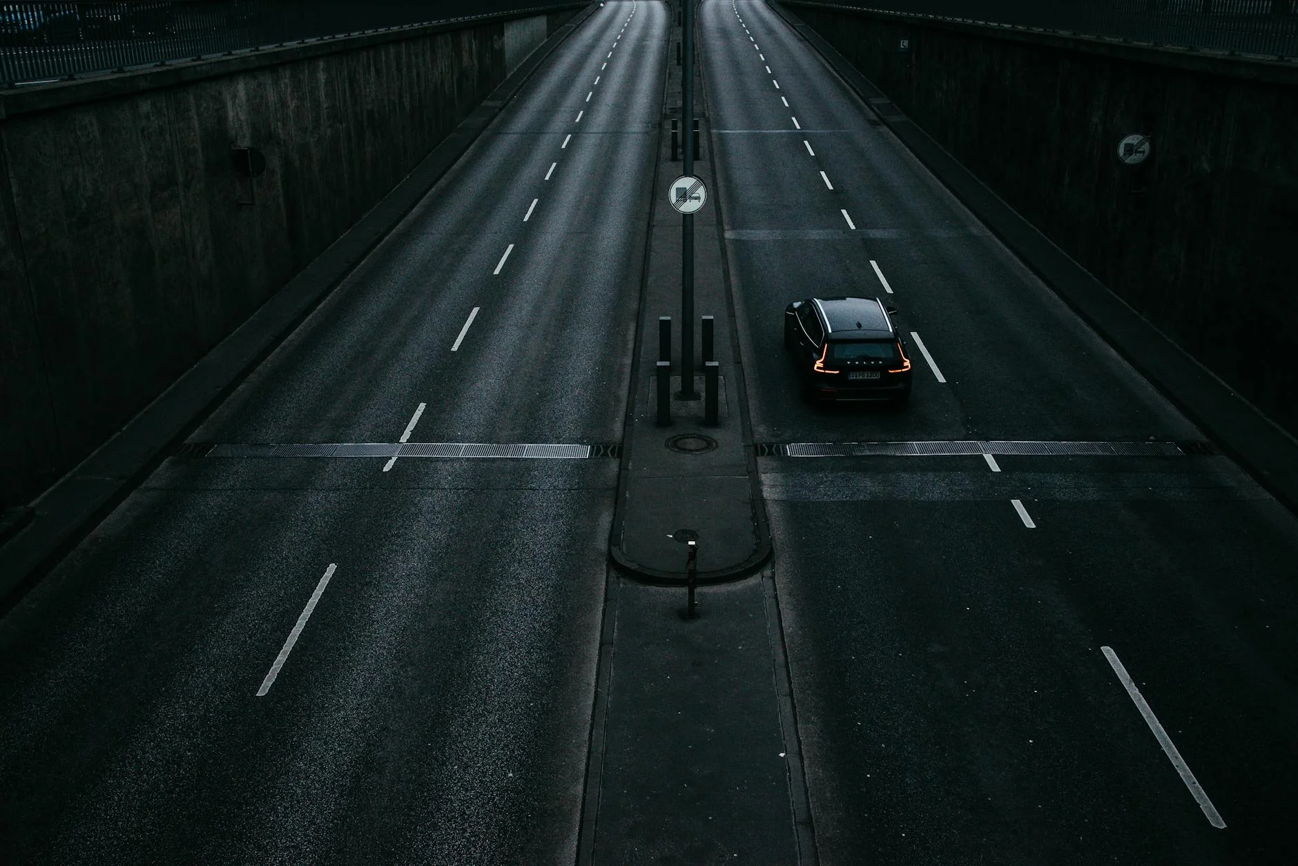 night highway lone car speeding lights empty road mystery