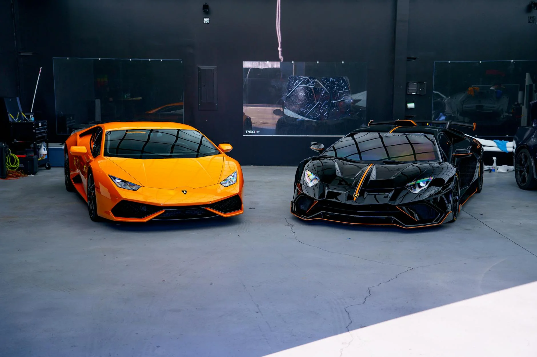 Lamborghini Porsche Ferrari supercar showroom luxury automotive